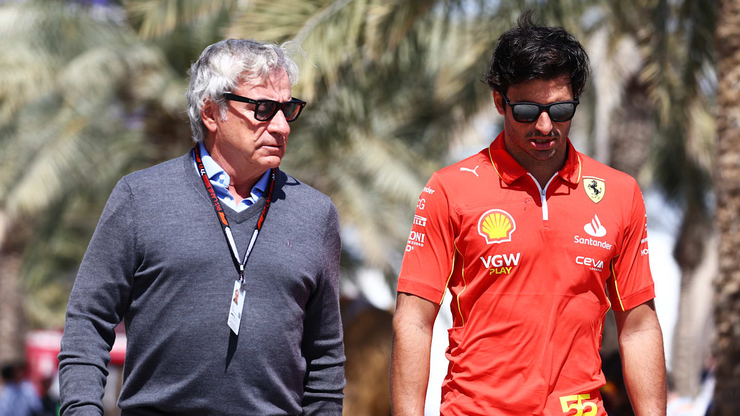 BAHRAIN, BAHRAIN - FEBRUARY 29: Carlos Sainz Sr and Carlos Sainz of Spain and Ferrari walk in the