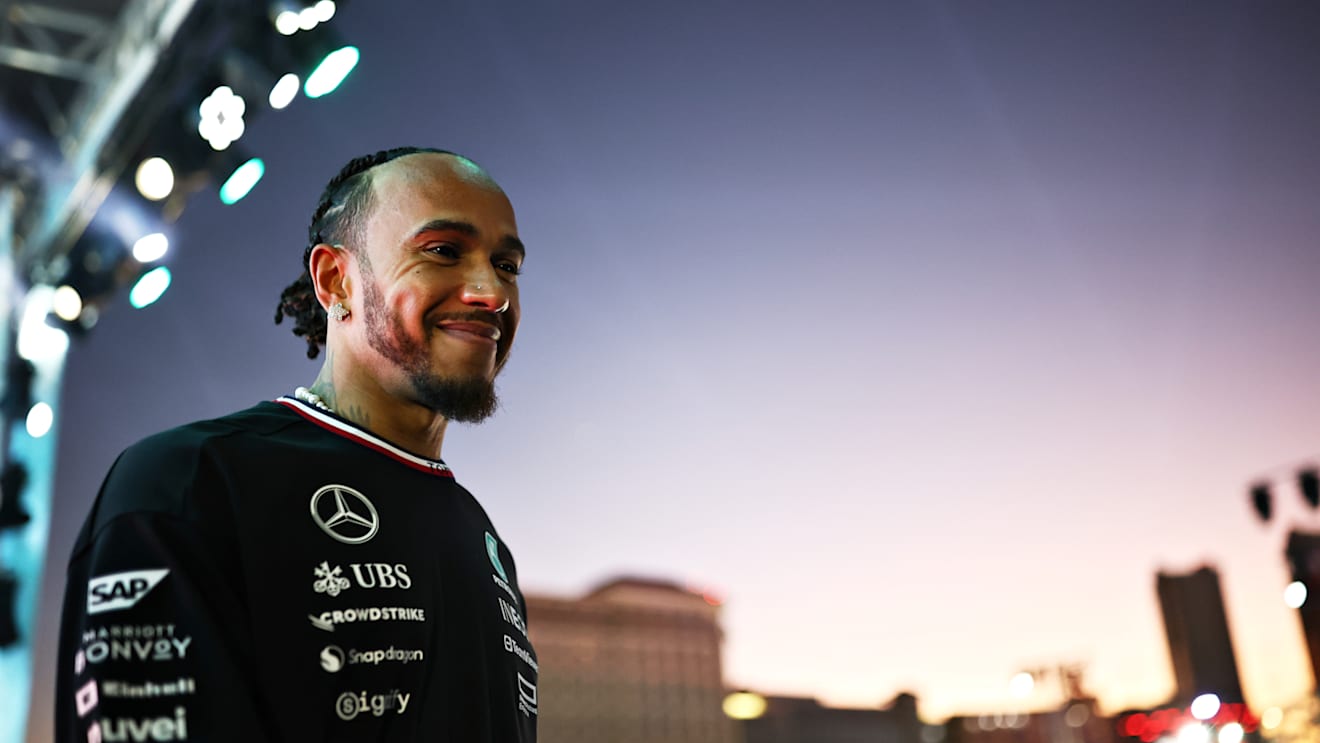 LAS VEGAS, NEVADA - NOVEMBER 21: Lewis Hamilton of Great Britain and Mercedes talks to the crowd on the fan stage prior to practice ahead of the F1 Grand Prix of Las Vegas at Las Vegas Strip Circuit on November 21, 2024 in Las Vegas, Nevada. (Photo by Jared C. Tilton - Formula 1/Formula 1 via Getty Images)