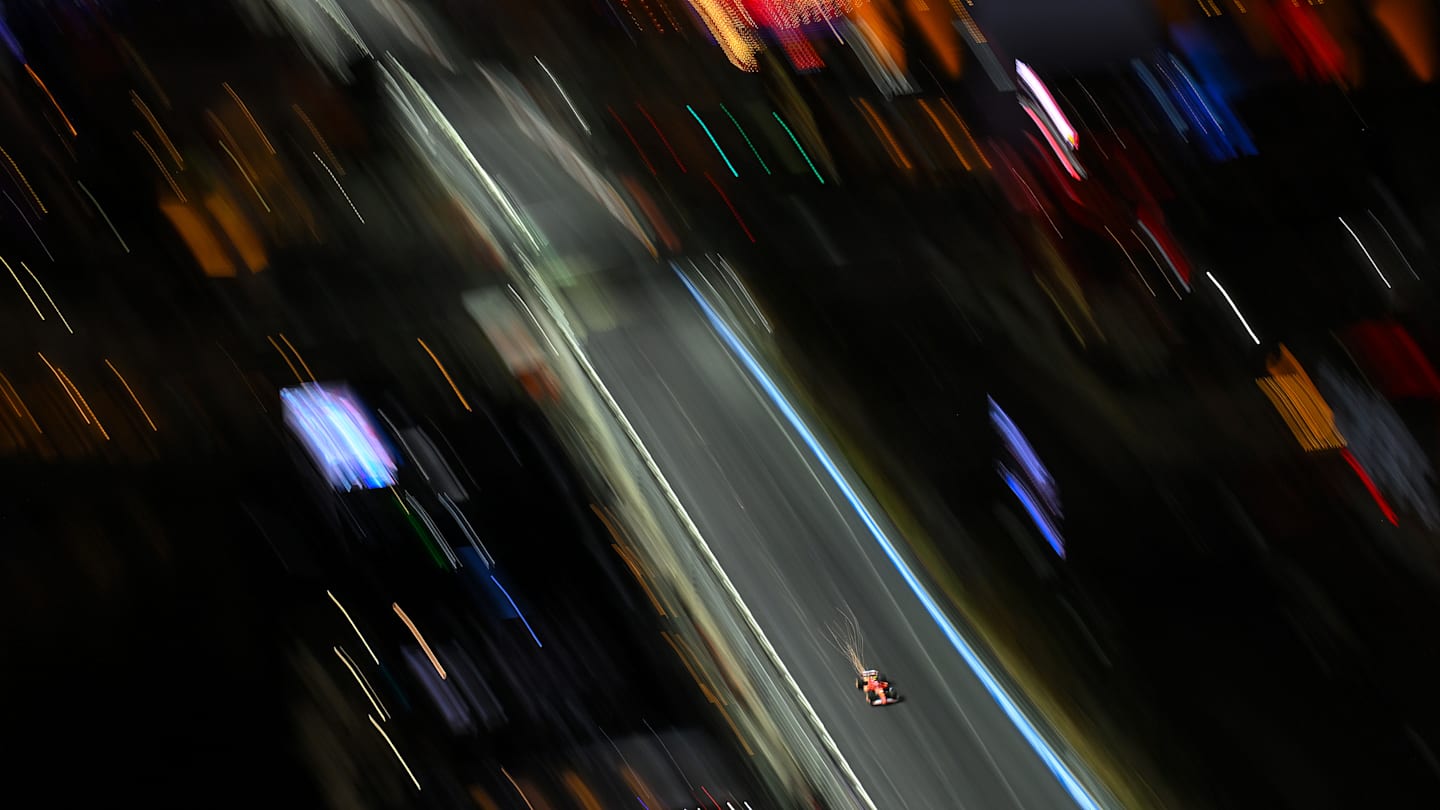 LAS VEGAS, NEVADA - NOVEMBER 21: Sparks fly behind Carlos Sainz of Spain driving (55) the Ferrari