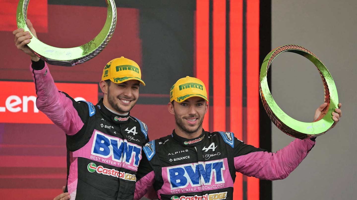 Alpine's French drivers Esteban Ocon (L) and Pierre Gasly celebrate at the podium their second and