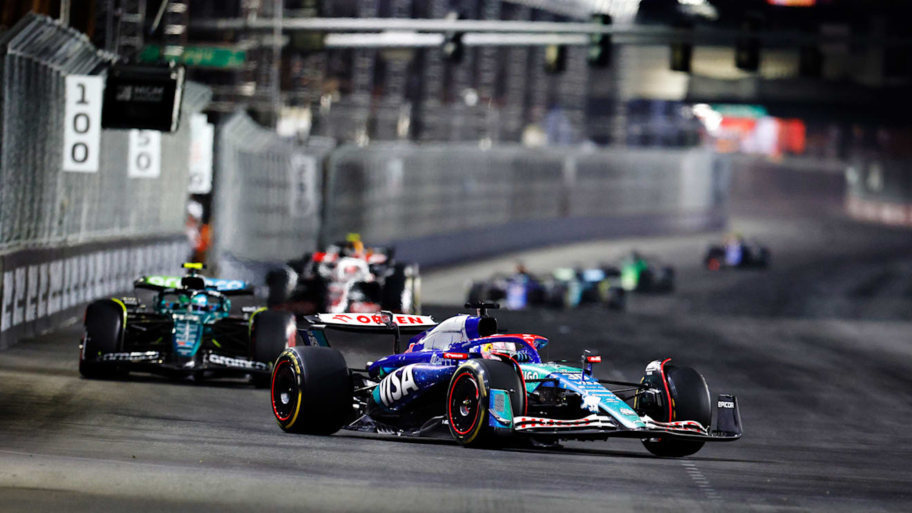 LAS VEGAS, NEVADA - NOVEMBER 23: Liam Lawson of New Zealand driving the (30) Visa Cash App RB VCARB 01 leads Fernando Alonso of Spain driving the (14) Aston Martin AMR24 Mercedes during the F1 Grand Prix of Las Vegas at Las Vegas Strip Circuit on November 23, 2024 in Las Vegas, Nevada. (Photo by Chris Graythen/Getty Images)