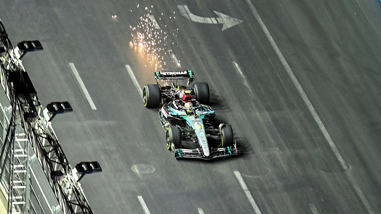 LAS VEGAS, NEVADA - NOVEMBER 23: Sparks fly from the car of Lewis Hamilton of Great Britain driving the (44) Mercedes AMG Petronas F1 Team W15 during the F1 Grand Prix of Las Vegas at Las Vegas Strip Circuit on November 23, 2024 in Las Vegas, Nevada. (Photo by Clive Mason/Getty Images)