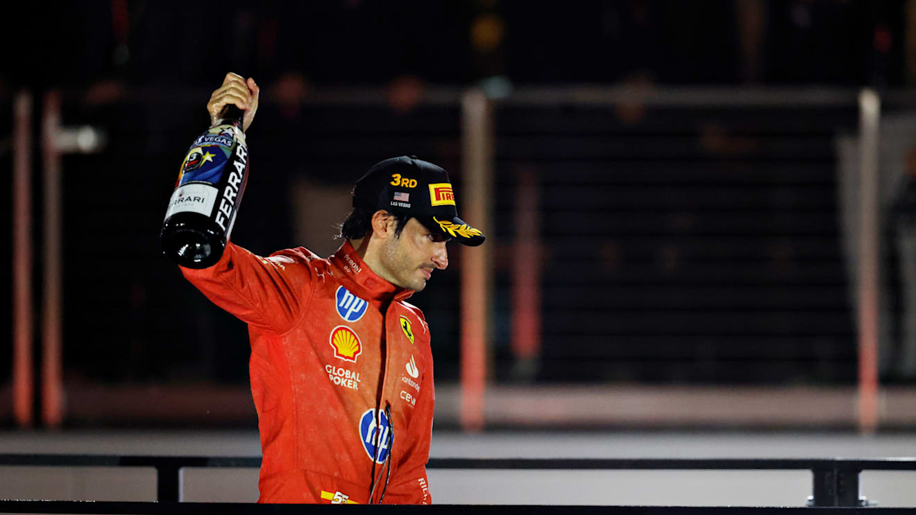 LAS VEGAS, NEVADA - NOVEMBER 23: Third placed Carlos Sainz of Spain and Ferrari celebrates on the podium during the F1 Grand Prix of Las Vegas at Las Vegas Strip Circuit on November 23, 2024 in Las Vegas, Nevada. (Photo by Chris Graythen/Getty Images)