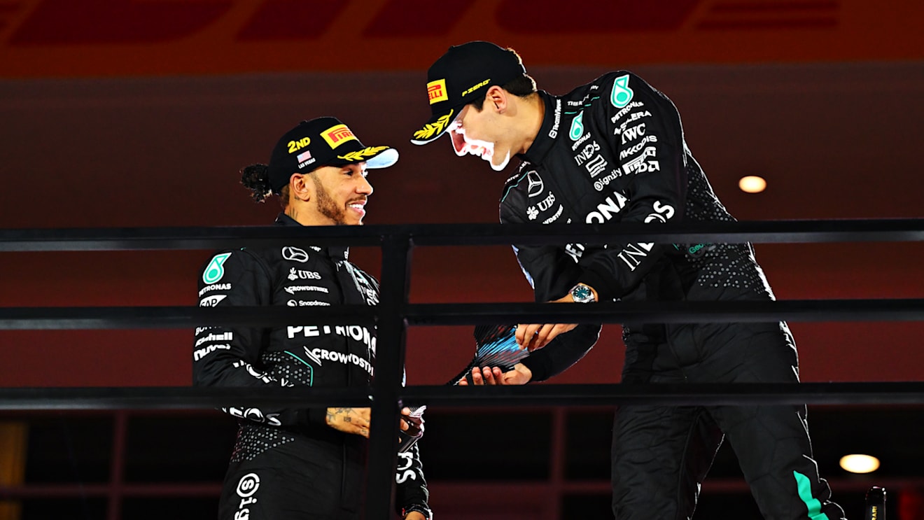 LAS VEGAS, NEVADA - NOVEMBER 23: Race winner George Russell of Great Britain and Mercedes and Second placed Lewis Hamilton of Great Britain and Mercedes celebrate on the podium during the F1 Grand Prix of Las Vegas at Las Vegas Strip Circuit on November 23, 2024 in Las Vegas, Nevada. (Photo by Mark Sutton - Formula 1/Formula 1 via Getty Images)