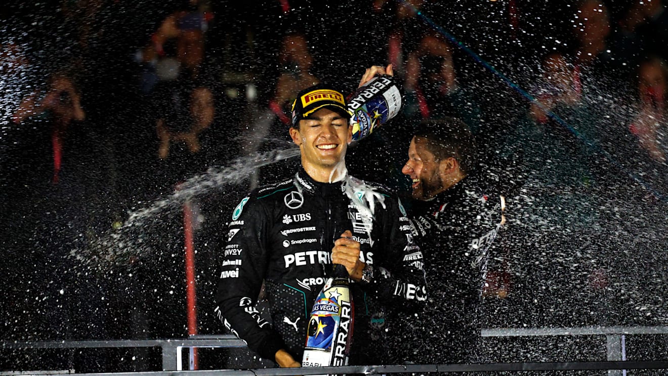 LAS VEGAS, NEVADA - NOVEMBER 23: Race winner George Russell of Great Britain and Mercedes celebrates on the podium during the F1 Grand Prix of Las Vegas at Las Vegas Strip Circuit on November 23, 2024 in Las Vegas, Nevada. (Photo by Chris Graythen/Getty Images)