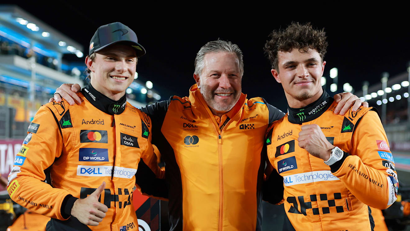 LUSAIL CITY, QATAR - NOVEMBER 30: Race winner Oscar Piastri of Australia and McLaren, McLaren Chief Executive Officer Zak Brown and second placed Lando Norris of Great Britain and McLaren pose for a photo in parc ferme during the Sprint ahead of the F1 Grand Prix of Qatar at Lusail International Circuit on November 30, 2024 in Lusail City, Qatar. (Photo by Bryn Lennon - Formula 1/Formula 1 via Getty Images)