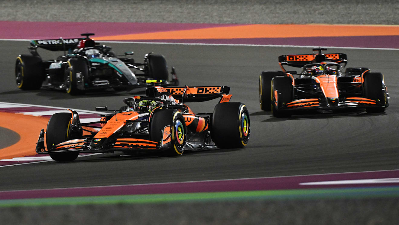 LUSAIL CITY, QATAR - NOVEMBER 30: Lando Norris of Great Britain driving the (4) McLaren MCL38 Mercedes leads Oscar Piastri of Australia driving the (81) McLaren MCL38 Mercedes and George Russell of Great Britain driving the (63) Mercedes AMG Petronas F1 Team W15 on track during the Sprint ahead of the F1 Grand Prix of Qatar at Lusail International Circuit on November 30, 2024 in Lusail City, Qatar. (Photo by Mark Sutton - Formula 1/Formula 1 via Getty Images)