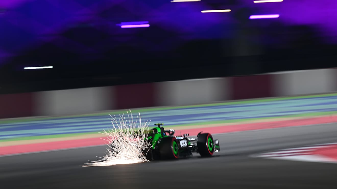 LUSAIL CITY, QATAR - NOVEMBER 30: Sparks fly behind Zhou Guanyu of China driving the (24) Kick Sauber C44 Ferrari during qualifying ahead of the F1 Grand Prix of Qatar at Lusail International Circuit on November 30, 2024 in Lusail City, Qatar. (Photo by Clive Mason/Getty Images)