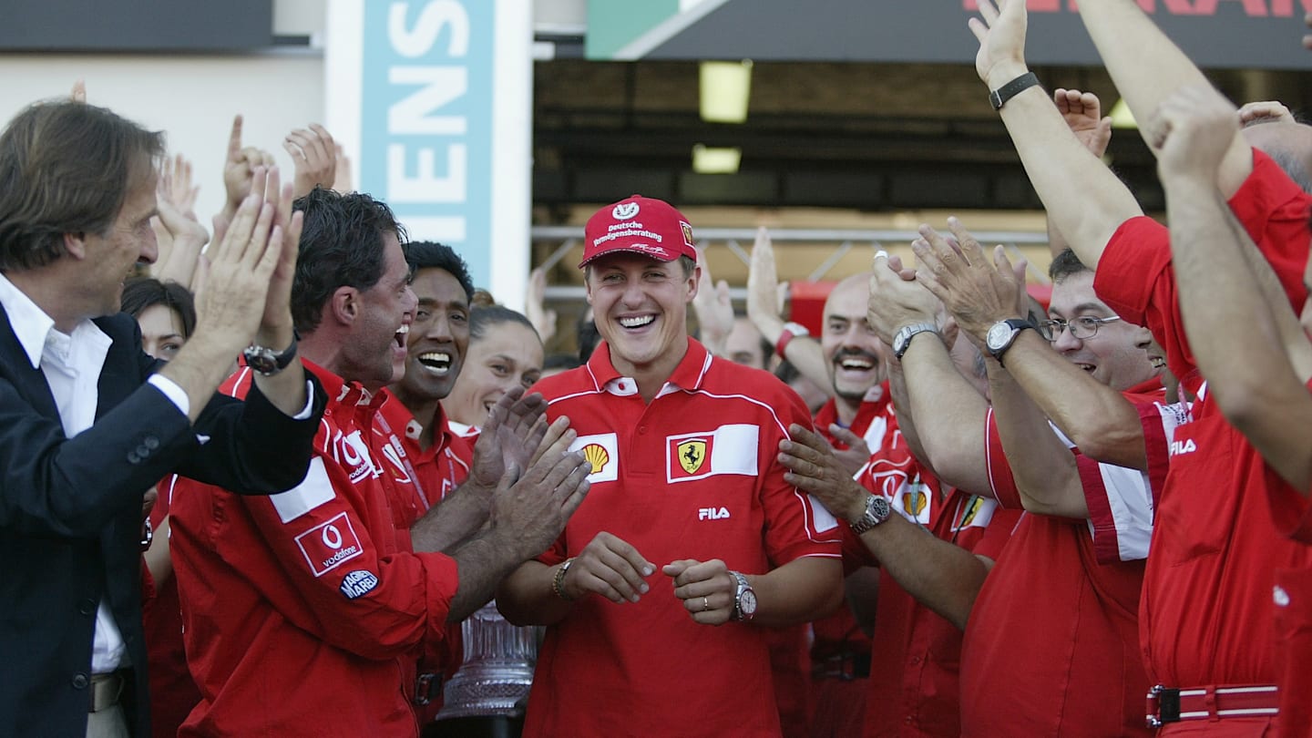 MAGNY-COURS - JULY 21:  Michael Schumacher is applauded by the Ferrari team after he won the