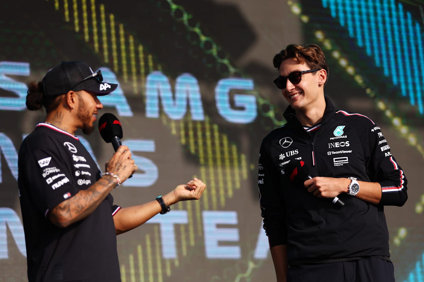 Lewis Hamilton and George Russell talk to the crowd prior to the Sprint ahead of the F1 Grand Prix of Qatar at Lusail International Circuit on November 30, 2024 in Lusail City, Qatar. (Photo by Bryn Lennon - Formula 1/Formula 1 via Getty Images)