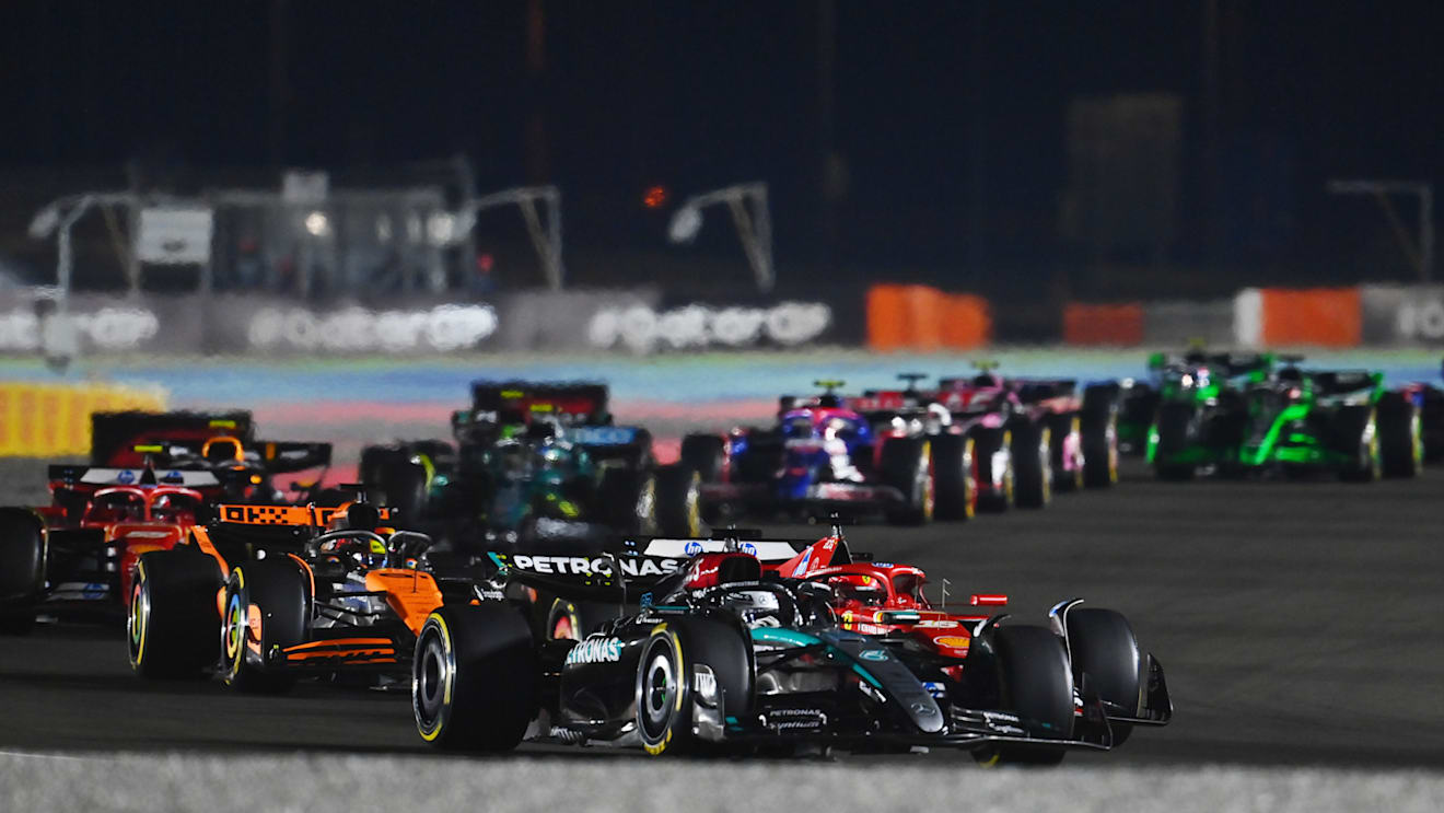 LUSAIL CITY, QATAR - DECEMBER 01: George Russell of Great Britain driving the (63) Mercedes AMG Petronas F1 Team W15 leads Charles Leclerc of Monaco driving the (16) Ferrari SF-24 on track during the F1 Grand Prix of Qatar at Lusail International Circuit on December 01, 2024 in Lusail City, Qatar. (Photo by James Sutton - Formula 1/Formula 1 via Getty Images)