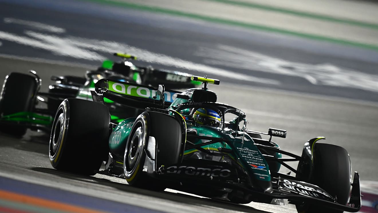 LUSAIL CITY, QATAR - DECEMBER 01: Fernando Alonso of Spain driving the (14) Aston Martin AMR24 Mercedes leads Zhou Guanyu of China driving the (24) Kick Sauber C44 Ferrari on track during the F1 Grand Prix of Qatar at Lusail International Circuit on December 01, 2024 in Lusail City, Qatar. (Photo by Clive Mason/Getty Images)