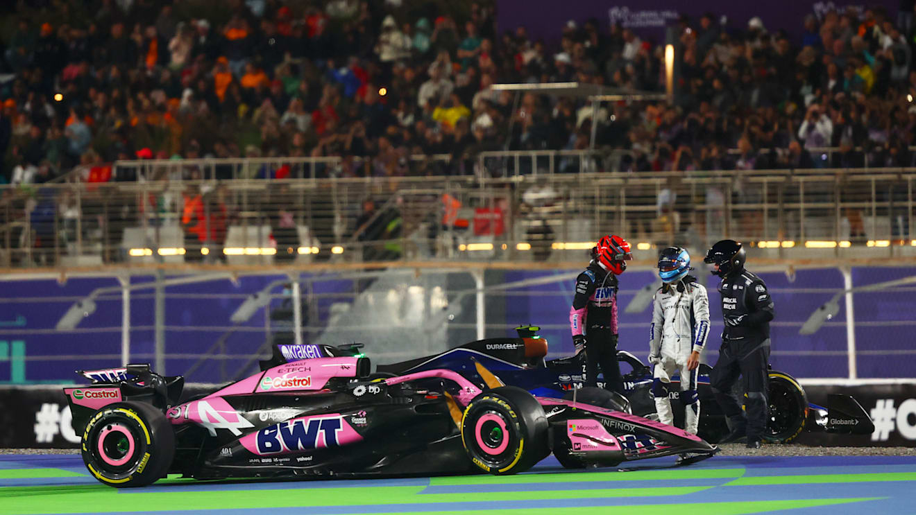 LUSAIL CITY, QATAR - DECEMBER 01: Esteban Ocon of France and Alpine F1 and Franco Colapinto of Argentina and Williams speak after crashing at the start during the F1 Grand Prix of Qatar at Lusail International Circuit on December 01, 2024 in Lusail City, Qatar. (Photo by Joe Portlock/Getty Images)