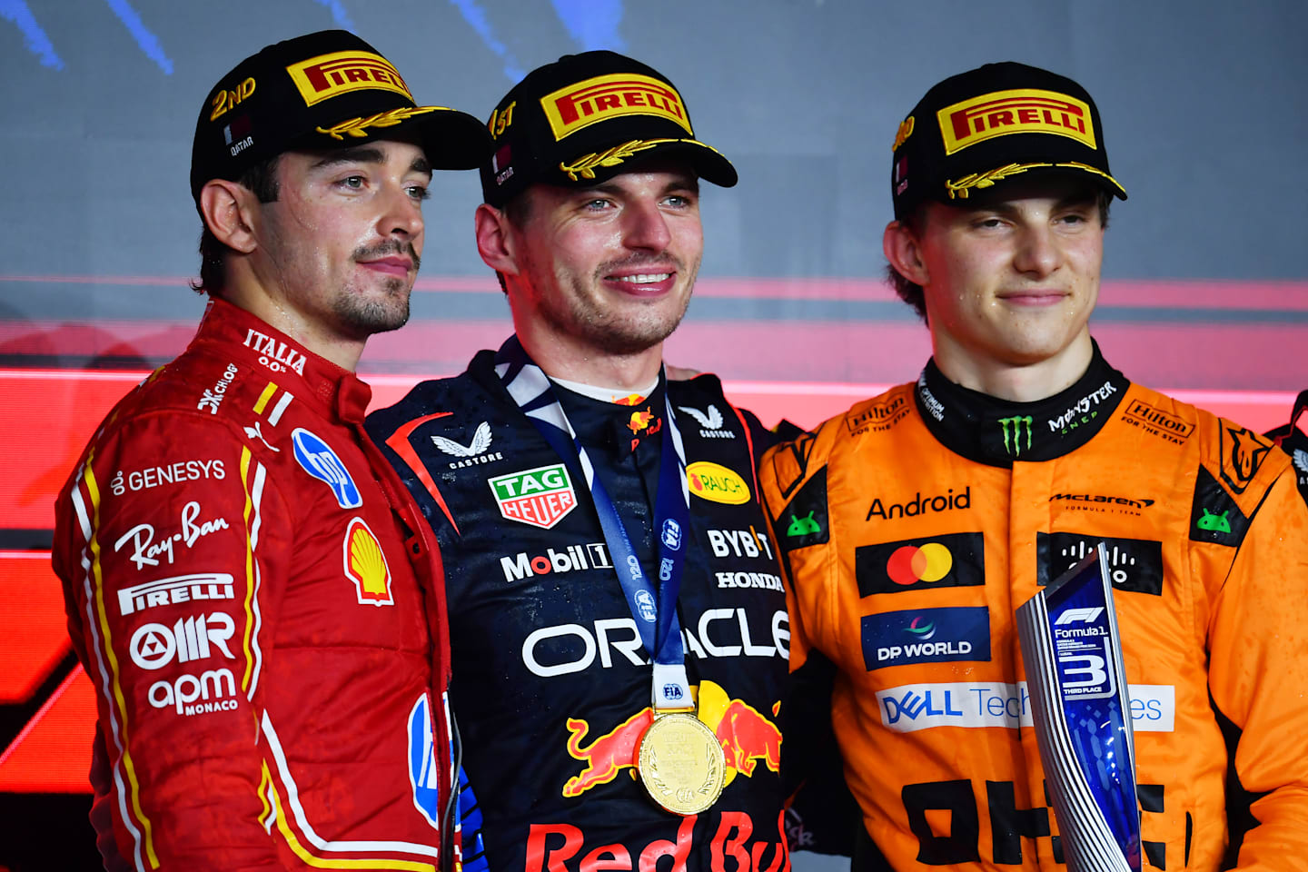 Max Verstappen, Charles Leclerc and Oscar Piastri celebrate on the podium during the F1 Grand Prix of Qatar at Lusail International Circuit on December 01, 2024 in Lusail City, Qatar. (Photo by James Sutton - Formula 1/Formula 1 via Getty Images)