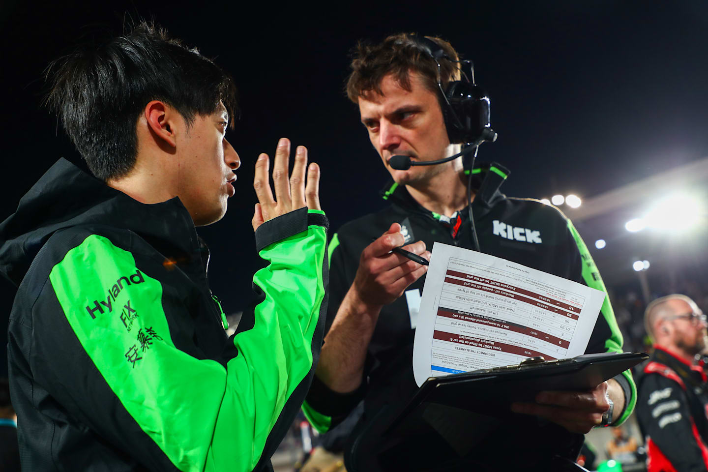 Zhou Guanyu of Stake F1 Kick Sauber and China talks with his engineer on the grid during the F1 Grand Prix of Qatar at Lusail International Circuit on December 01, 2024 in Lusail City, Qatar. (Photo by Peter Fox/Getty Images)