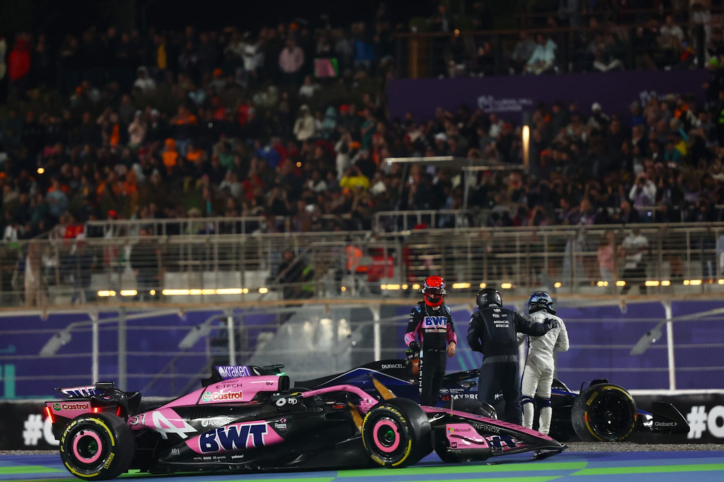 Esteban Ocon and Franco Colapinto of Argentina and Williams talk after crashing at the start during the F1 Grand Prix of Qatar at Lusail International Circuit on December 01, 2024 in Lusail City, Qatar. (Photo by Joe Portlock/Getty Images)