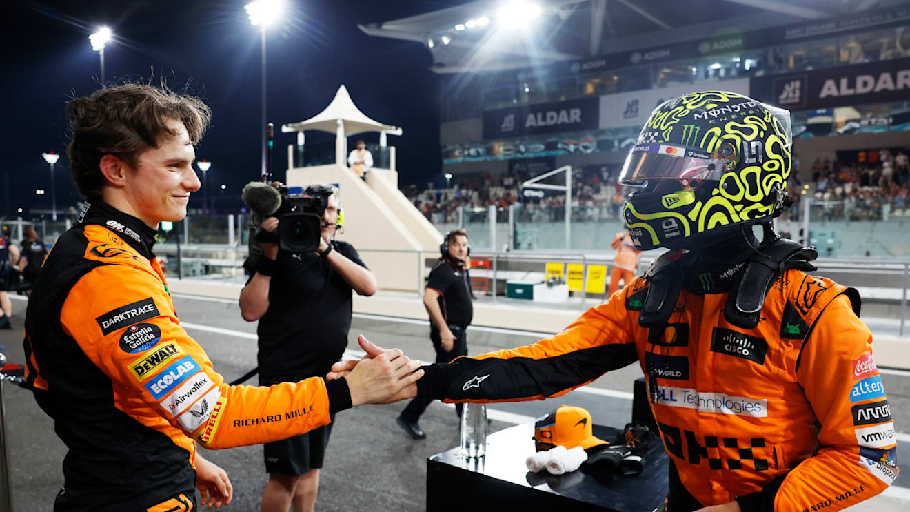 YAS MARINA CIRCUIT, UNITED ARAB EMIRATES - DECEMBER 07: Oscar Piastri, McLaren F1 Team, and pole man Lando Norris, McLaren F1 Team, congratulate each other in Parc Ferme during the Abu Dhabi GP at Yas Marina Circuit on Saturday December 07, 2024 in Abu Dhabi, United Arab Emirates. (Photo by Steven Tee / LAT Images)