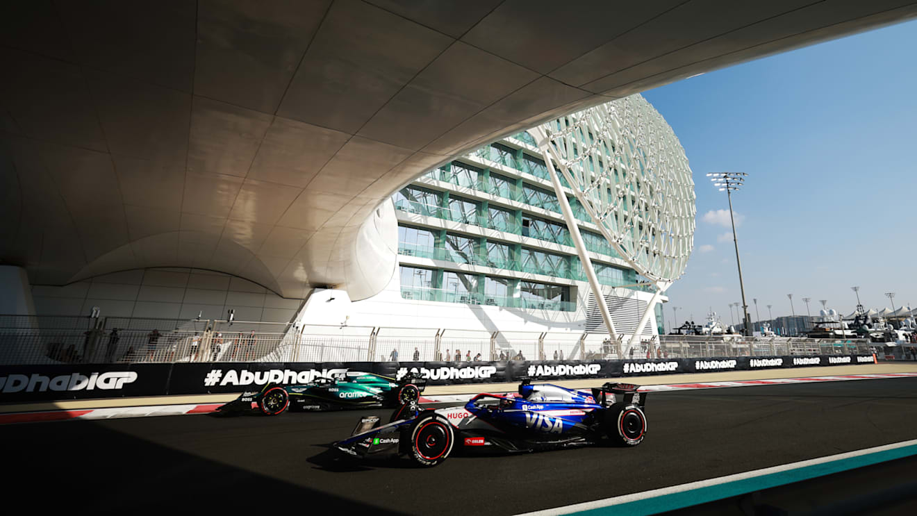 ABU DHABI, UNITED ARAB EMIRATES - DECEMBER 07: Lance Stroll of Canada driving the (18) Aston Martin AMR24 Mercedes and Liam Lawson of New Zealand driving the (30) Visa Cash App RB VCARB 01 on track during final practice ahead of the F1 Grand Prix of Abu Dhabi at Yas Marina Circuit on December 07, 2024 in Abu Dhabi, United Arab Emirates. (Photo by Bryn Lennon - Formula 1/Formula 1 via Getty Images)