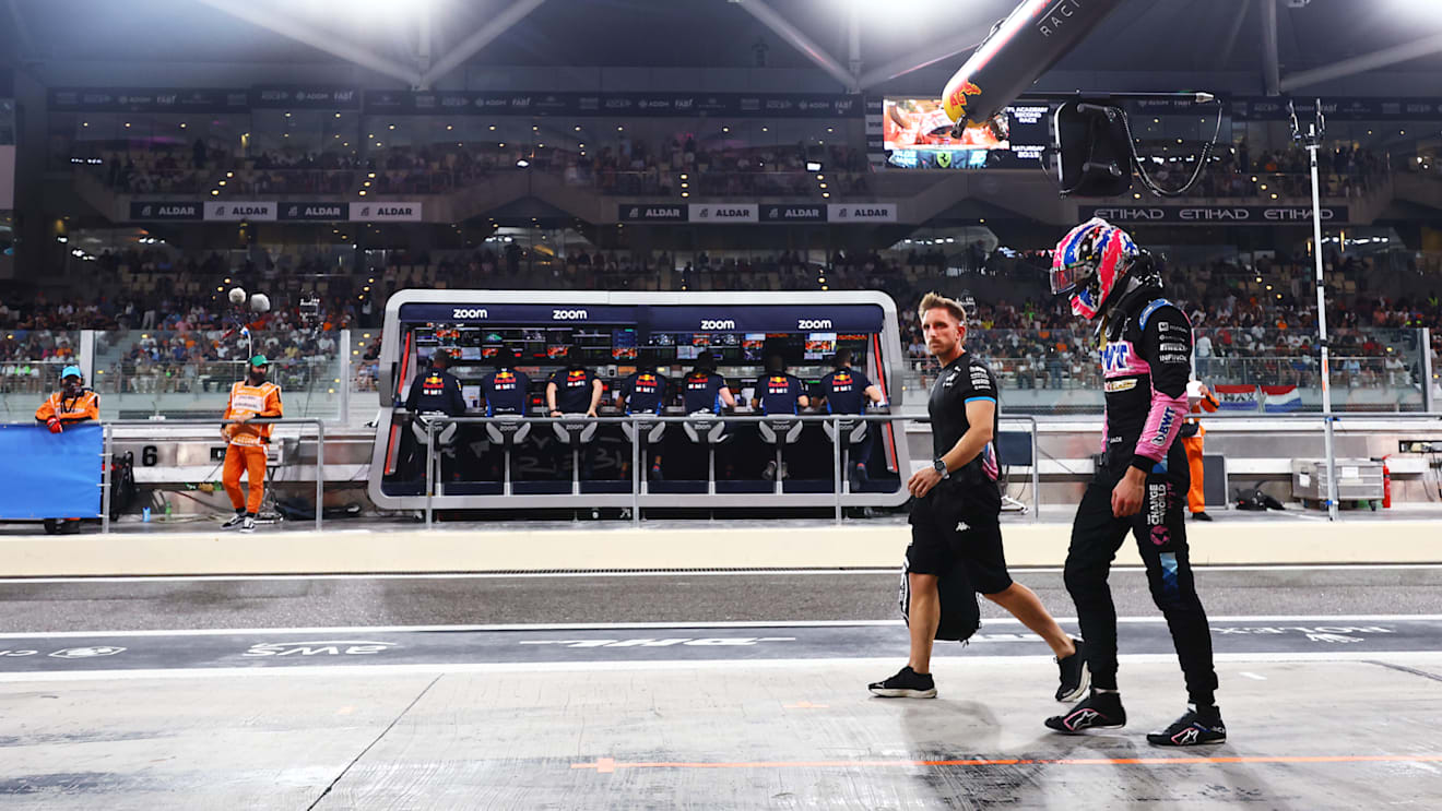 ABU DHABI, UNITED ARAB EMIRATES - DECEMBER 07: 20th placed qualifier Jack Doohan of Australia and Alpine F1 walks in the Pitlane during qualifying ahead of the F1 Grand Prix of Abu Dhabi at Yas Marina Circuit on December 07, 2024 in Abu Dhabi, United Arab Emirates. (Photo by Mark Thompson/Getty Images)